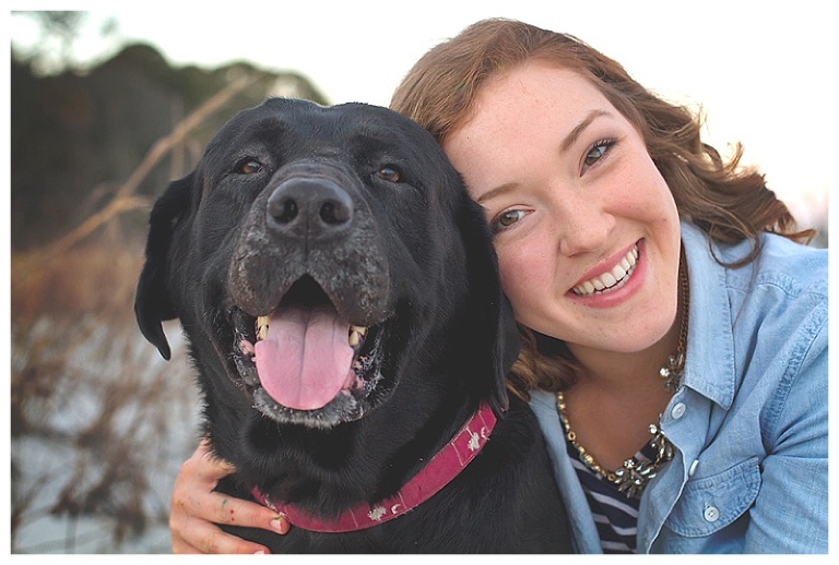 a girl and her black lab
