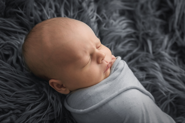 Beaufort newborn boy grey furry background