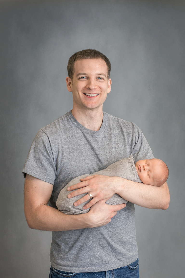 father & son newborn image on grey background Beaufort SC 