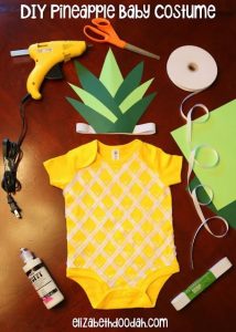 Lay out of DIY Pineapple Costume with construction paper crown