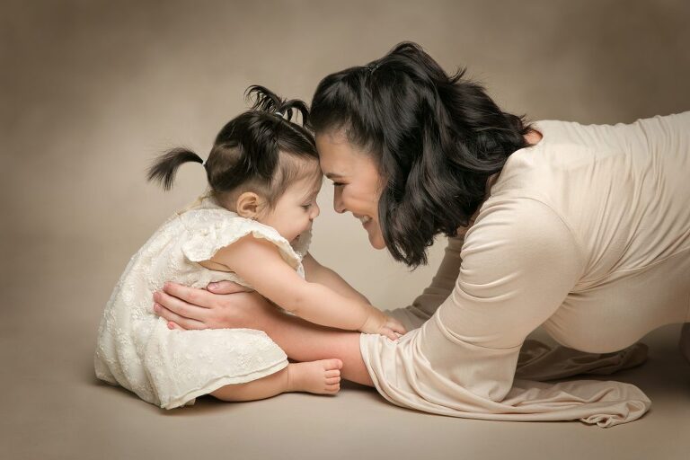 family studio photography mom with little girl in white dress