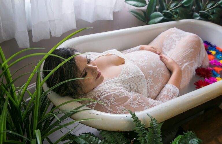 maternity milk bath session with flowers and greenery