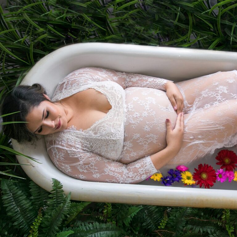 maternity milk bath session with flowers and greenery