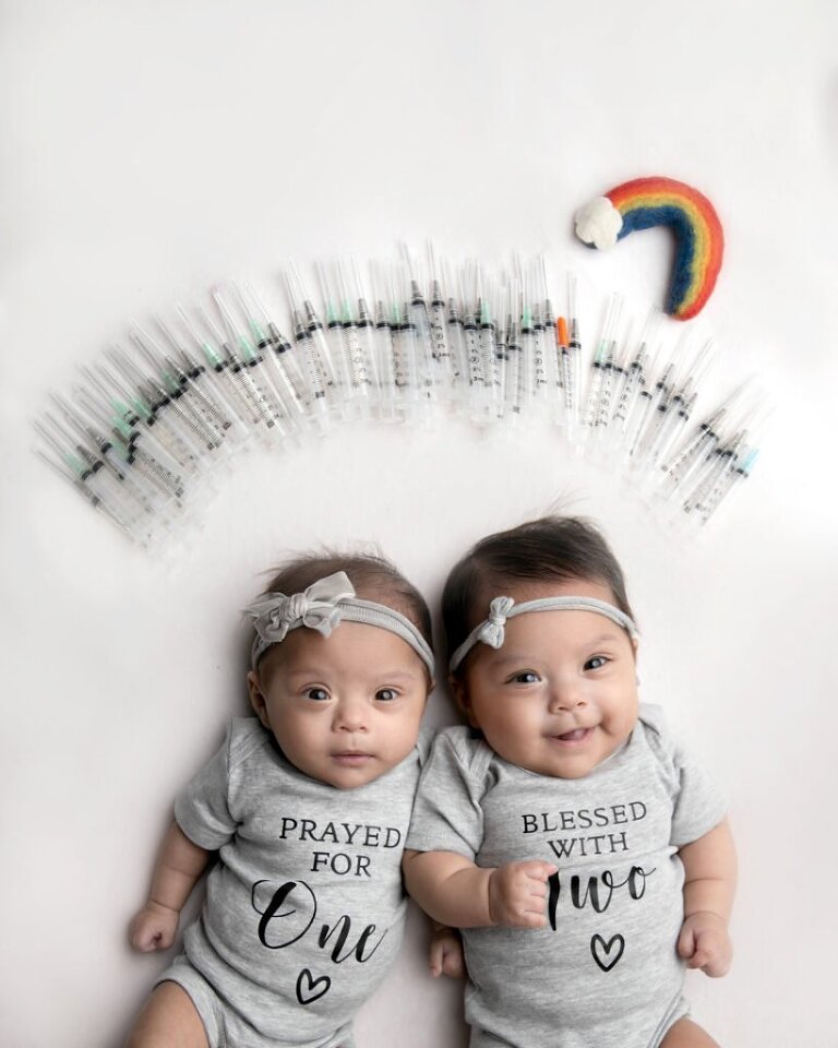 IVF twin newborn session with medication needles and custom onesies. 